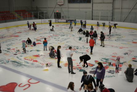 Painting the ice at Pat Burns Arena